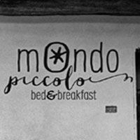 B&B Mondo Piccolo a Roccabianca con immagine della struttura e invito a soggiornare nella Bassa Parmense tra natura, relax e tradizioni locali.