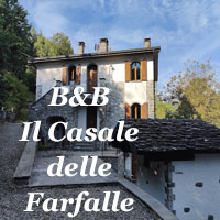 B&B Casale delle Farfalle Tornolo con casale rurale e panorama naturale dell’Appennino parmense.